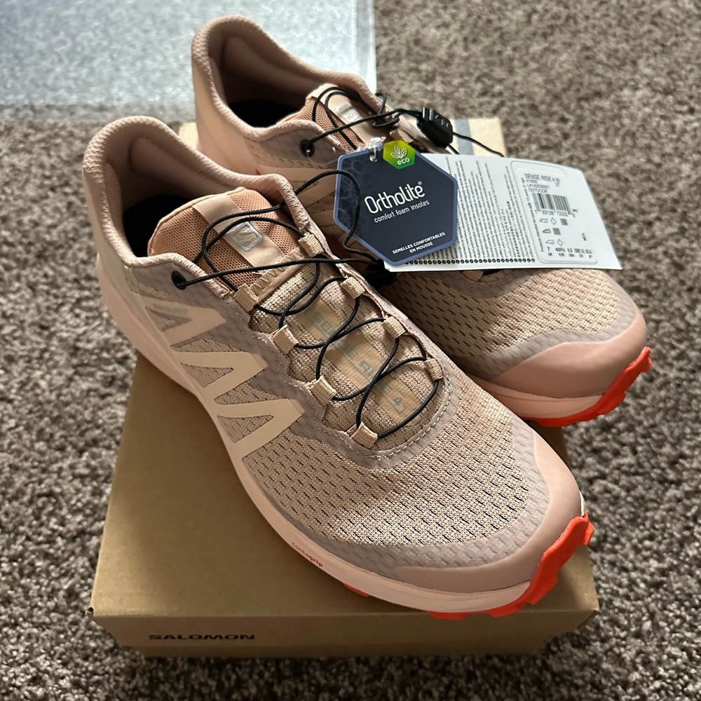 A brand new pair of hiking sneakers perfect for a summer hike!!